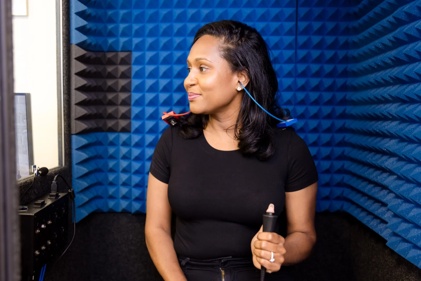 A patient in the sound booth, listening for the tones